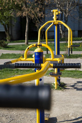 Health training simulators equipment on playground. Area with coating of rubber crumbs
