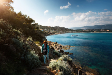 Woman walking with dog on path on hill at the Cote d'Azur