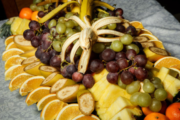 top view on assortment of exotic tropical fruits on big plate