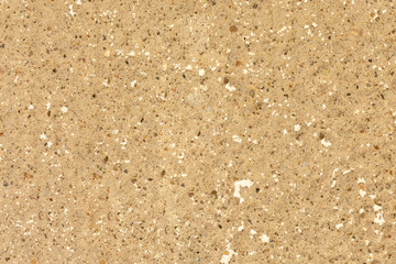 copyspace background texture beige wall of plaster with small colorful natural stones