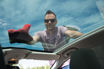 Man cleaning car with microfiber cloth