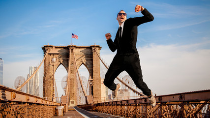 Businessman model jumping and celebrating business success