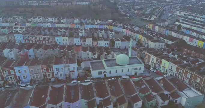 British Islam: aerial of green and white Totterdown mosque and minaret surrounded by colourful terraced traditional English residential houses in the South Bristol suburb of Totterdown in the United Kingom