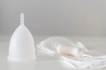 Fototapeta na wymiar Menstrual cup, sanitary pad and tampon. Feminine Hygiene concept