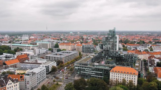 Hannover, Germany a bird's-eye view. The combination of modern and ancient architecture. Modern house on the background of the old town. In the frame of the road, cars. Slow Motion.