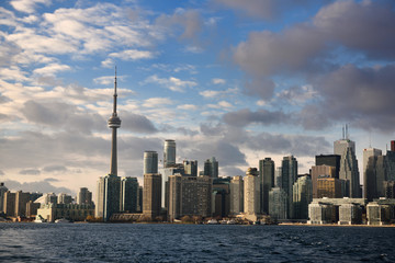 Evening sunlight on Toronto skyline highrise towers from Ferry in harbour