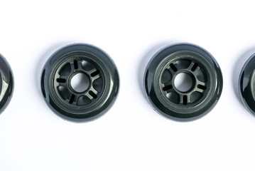 Inline skate wheels, two rollerblade wheels isolated on white background