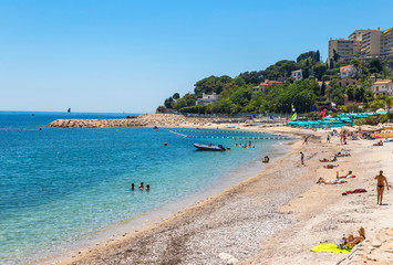 Fototapeta na wymiar Plage Marquet Beach in Cap d'Ail town. Popular beach within a walking distance of the Monaco border