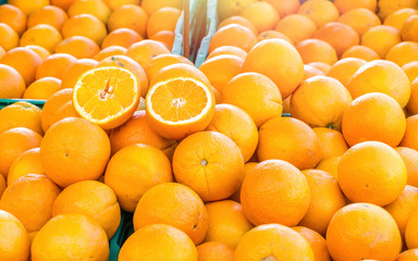 Fresh oranges for sale in local farmers market place on stall