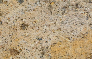Earth texture. Pebbles in the ground. Beige background