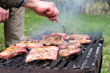 Chef preparing barbecue outdoors