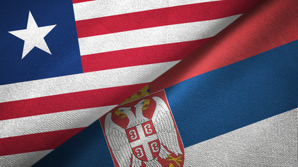 Fototapeta premium Liberia and Serbia two flags textile cloth, fabric texture