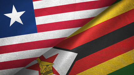 Obraz premium Liberia and Zimbabwe two flags textile cloth, fabric texture