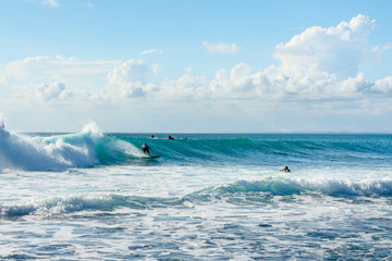 5 May 2019 : Balangan Beach, Bali, Indonesia - Man riding wave on a sunny summers day.