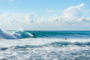 Obraz premium 5 May 2019 : Balangan Beach, Bali, Indonesia - Man riding wave on a sunny summers day.