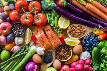 Gardinen Farbenfroh Flat lay arrangement of a selection of healthy clean eating foods including raw organic fruits, vegetables, eggs, nuts and spices.  © Carey