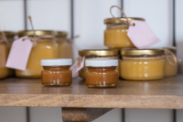 Selection of honey in small honey jars. Jars of honey on the counter