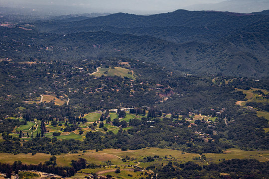 Aerial View of a Golf Course and Tree Lined Mountains in the Portola Valley outside of Silicon Valley, California, USA