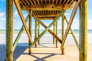 Sandy beach and pier on Edisto Island, South Carolina