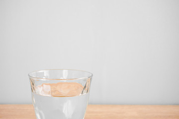 Glass of water on the table. テーブルの上のグラス一杯の水