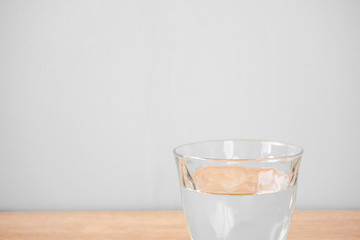 Glass of water on the table. テーブルの上のグラス一杯の水