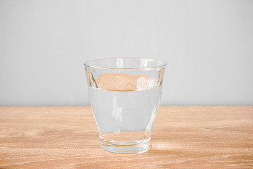 Glass of water on the table. テーブルの上のグラス一杯の水
