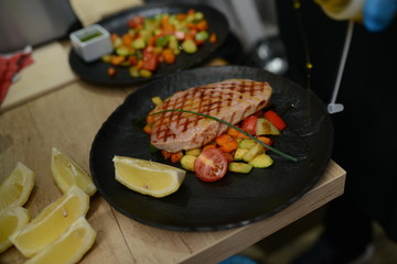 Making dinner at restaurant. Proffesional cooker