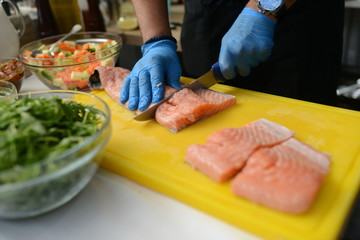 Making dinner at restaurant. Proffesional cooker