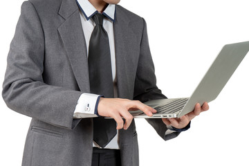 Happy young businessman standing hold laptop in suit on white background, isolated concept