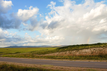 Landscape of mountains, route and plain