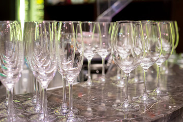 a lot of glasses on the bar