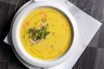 Pumpkin crab soup on a white bowl