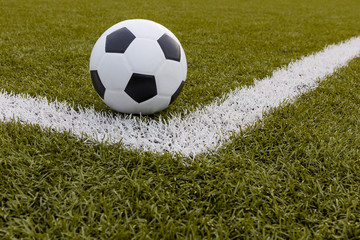Soccer ball ,Football on artificial grass with white stripe
