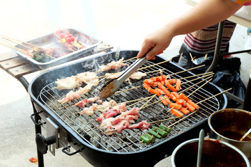 grilling meat and vegetables on grill