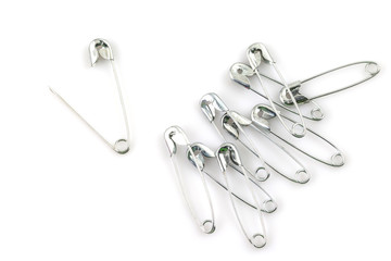 Bunch of safety pins isolated on white