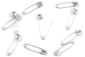 Bunch of safety pins isolated on white