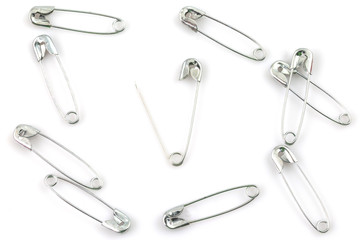 Bunch of safety pins isolated on white