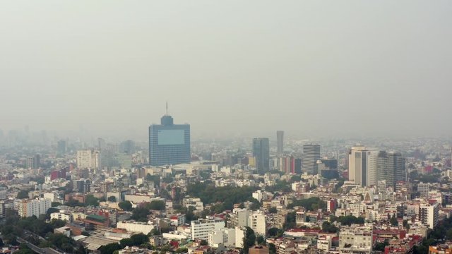 Aerial shot of the skyline of Mexico City in a very polluted day