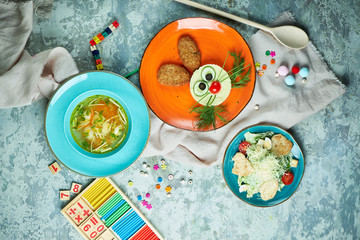 Children's menu On a gray textured background. A beautiful table setting.