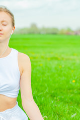 Meditation. Woman doing yoga and listening to relax music.