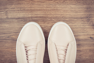 Vintage photo, Womanly leather shoes on board