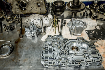 Transmission valve body components in repair shop
