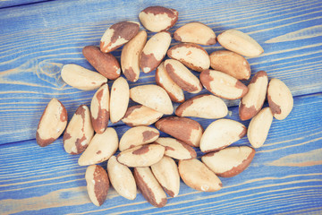 Vintage photo, Heap of brazil nuts on old blue boards