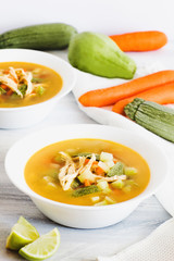 Chicken soup and in white bowl mexican food broth in mexico city