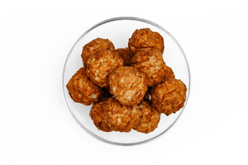 Roasted meatballs in a glass bowl
