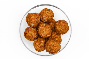 Roasted meatballs in a glass bowl