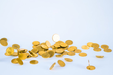 Movement of falling gold coin, flying coin, rain money with soft shadow on white background, business and financial wealth and take profit concept.