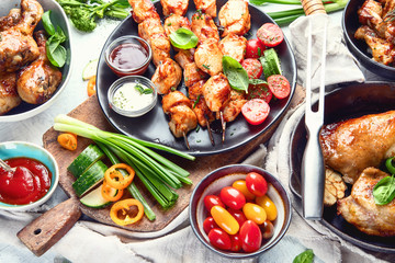 Grilled chicken meat meals on table. Top view