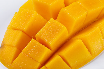 ripe yellow mango cut slice whole on white background