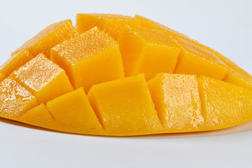ripe yellow mango cut slice whole on white background